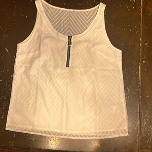 Never worn tank top white size medium it is a bigger medium
